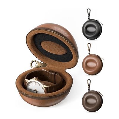Brown leather case with a watch inside, accompanied by smaller brown and black cases on a white background.