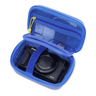 An open hard-shell digital camera case with blue mesh compartments and a blue strap holding a Canon G7X camera, shown on a white background.