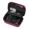 A red and black digital camera case shown open, containing a Canon G7X camera. The case features a zippered exterior, a black interior, and multiple mesh pockets for accessories, photographed on a solid white background.