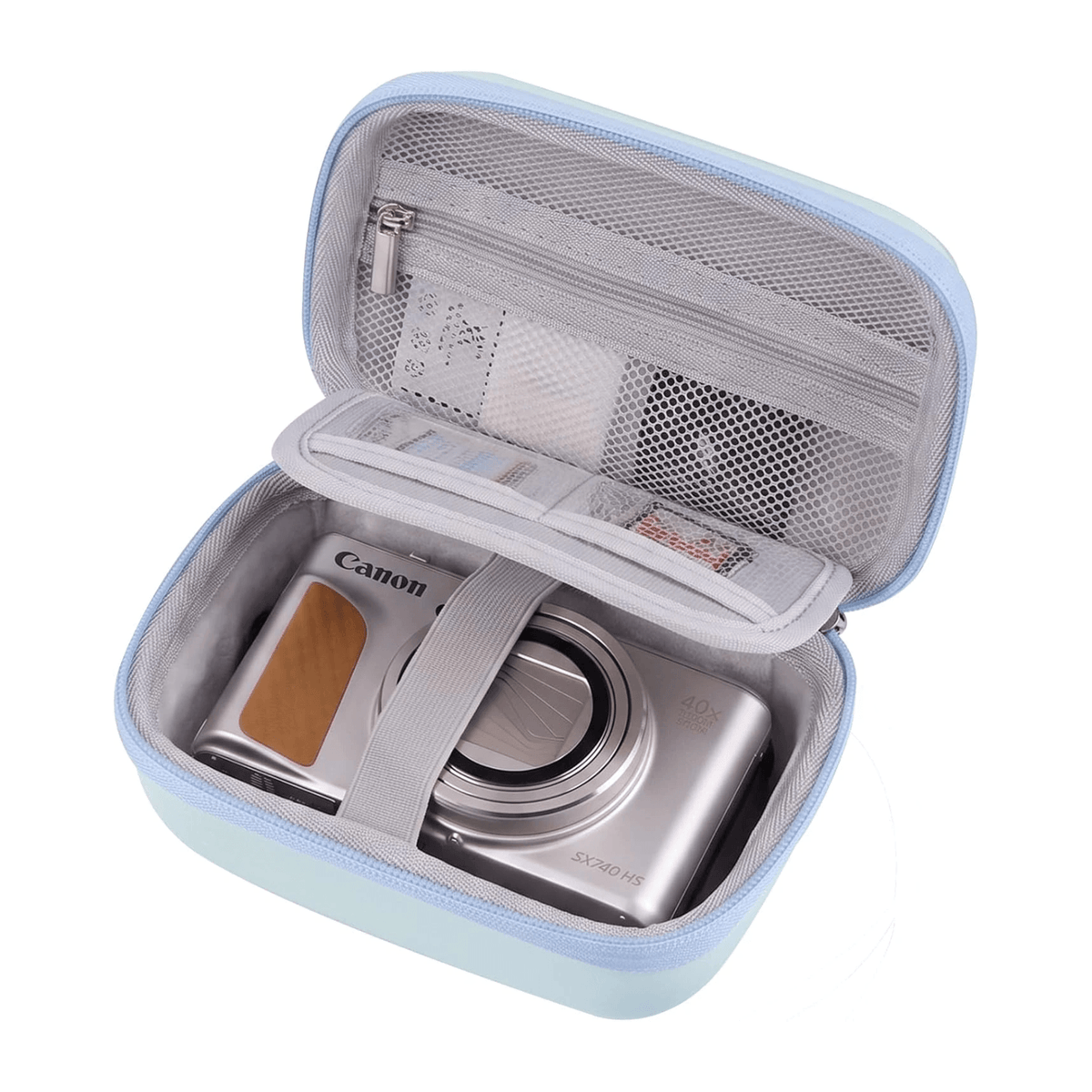 A light blue and gray digital camera case shown open, containing a silver Canon digital camera. The case features a zippered main compartment, a top lid pocket with mesh lining, and an elastic strap holding the camera in place, all on a solid white background.