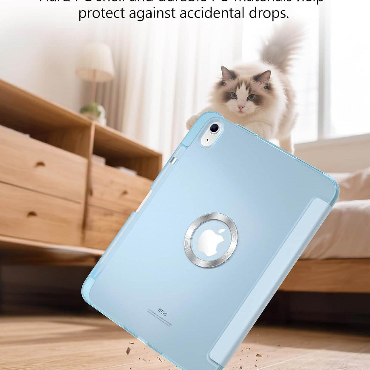 A light blue iPad A16 11th/10th Gen Smart Case shown floating in midair over a wooden floor, with a fluffy cat sitting on a bed in the background. Text at the top reads 'Built to Handle Everyday Impacts' and 'Hard PC shell and durable PU materials help protect against accidental drops.