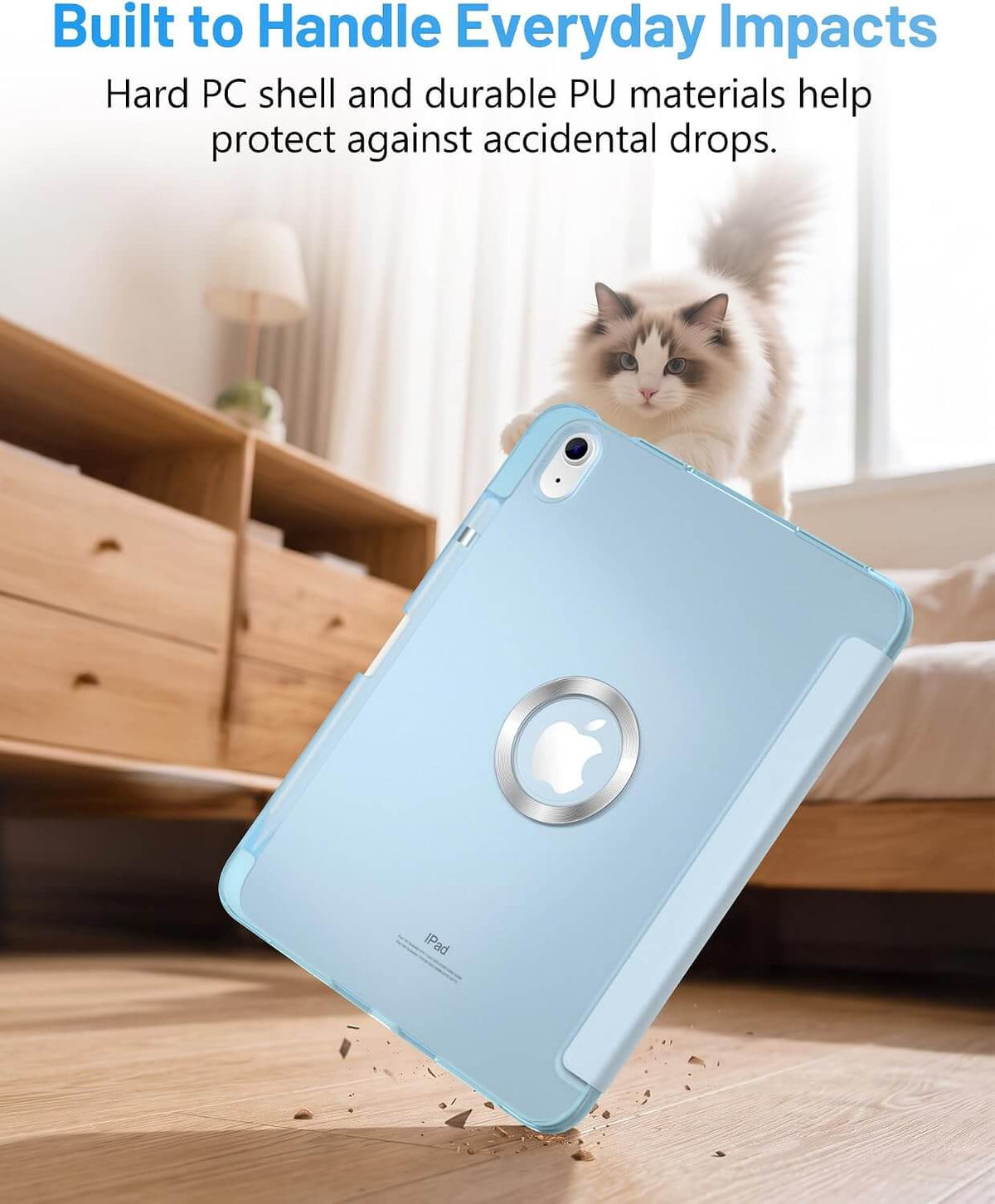 A light blue iPad A16 11th/10th Gen Smart Case shown floating in midair over a wooden floor, with a fluffy cat sitting on a bed in the background. Text at the top reads 'Built to Handle Everyday Impacts' and 'Hard PC shell and durable PU materials help protect against accidental drops.