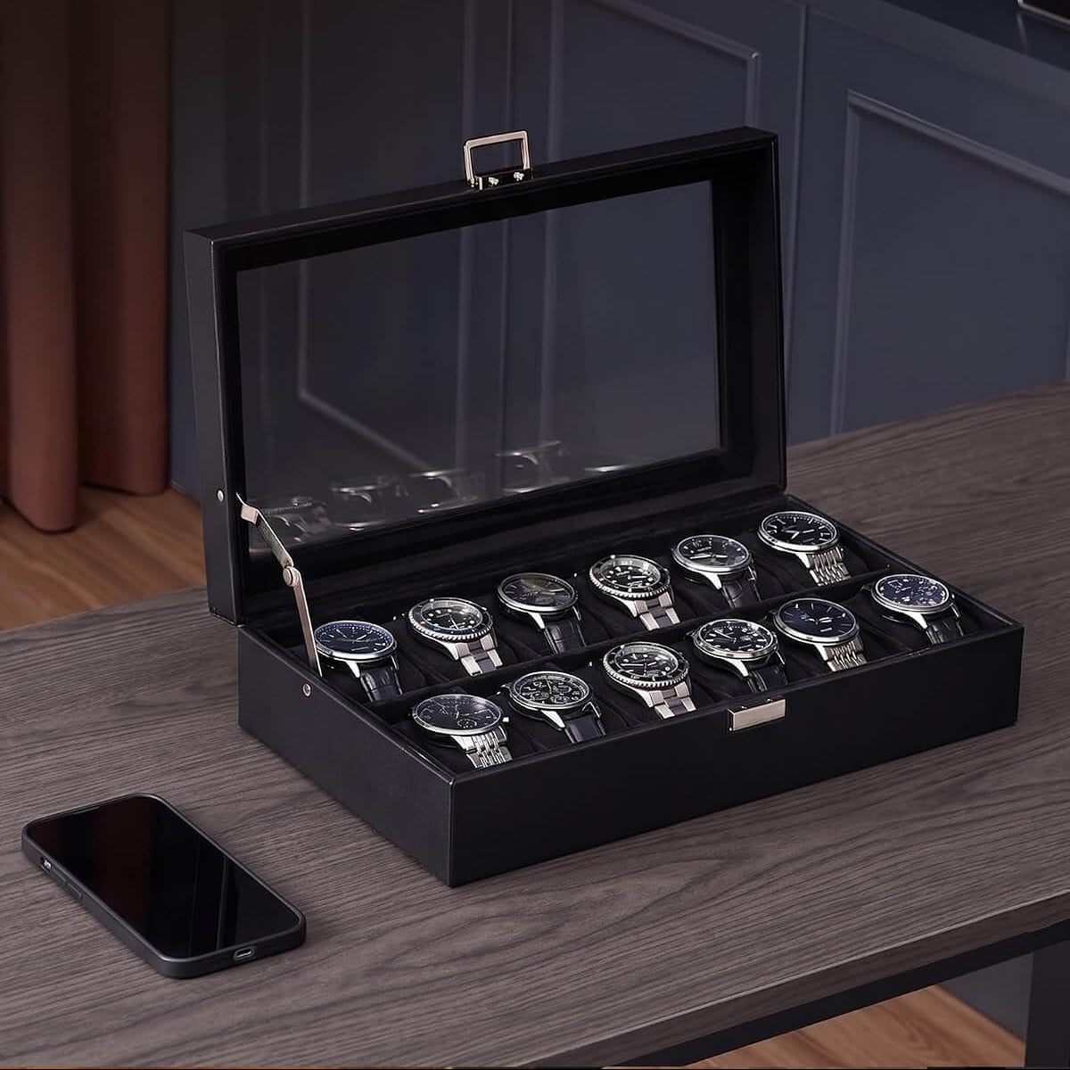 Black watch box with glass lid, 12-watch capacity, and elegant display design