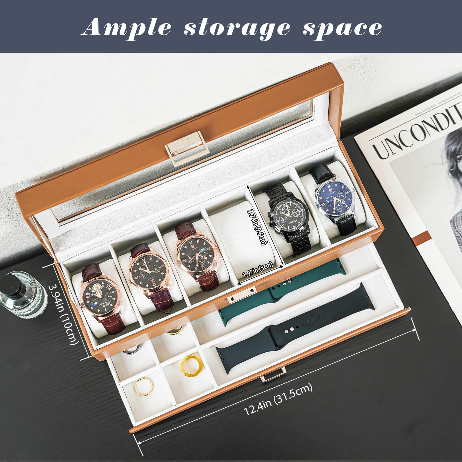Watch storage box with multiple watches and accessories on a table.