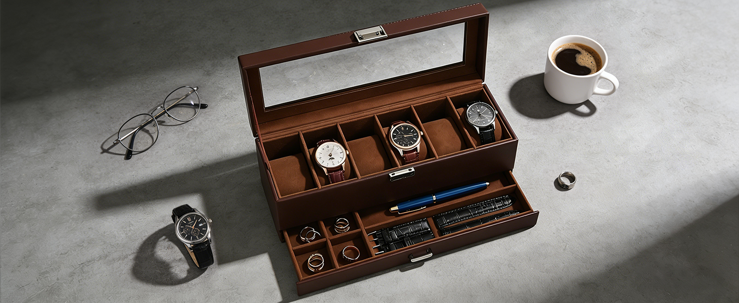 Brown watch box with watches, glasses, and a cup of coffee on a gray surface