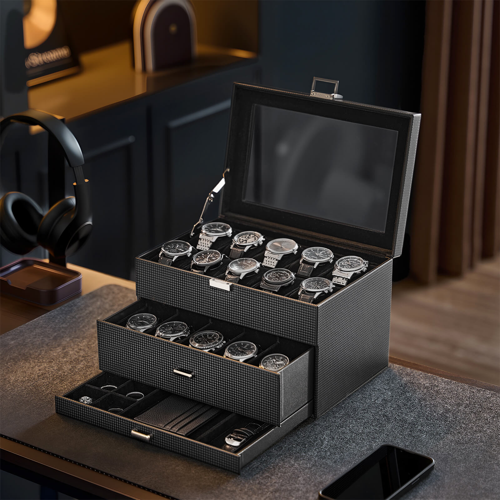 Black watch collection display case with multiple watches on a wooden surface.