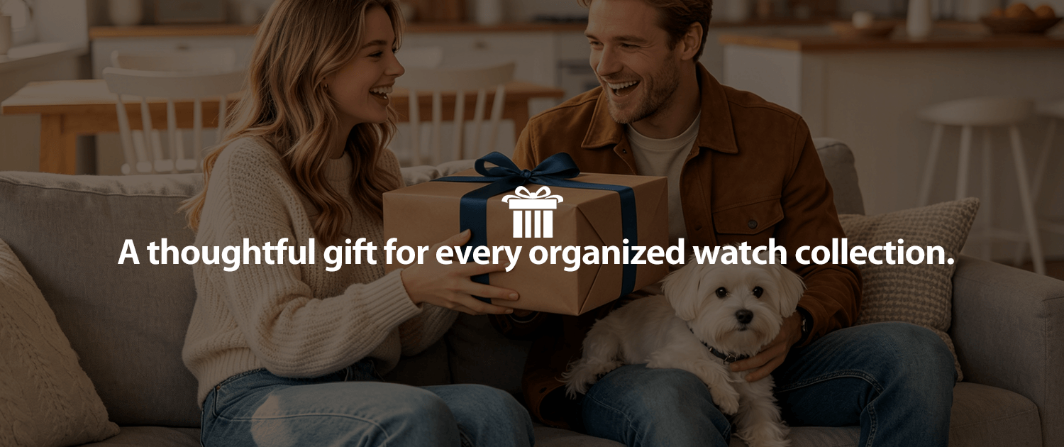 Man and woman sitting on a couch, holding a gift box.