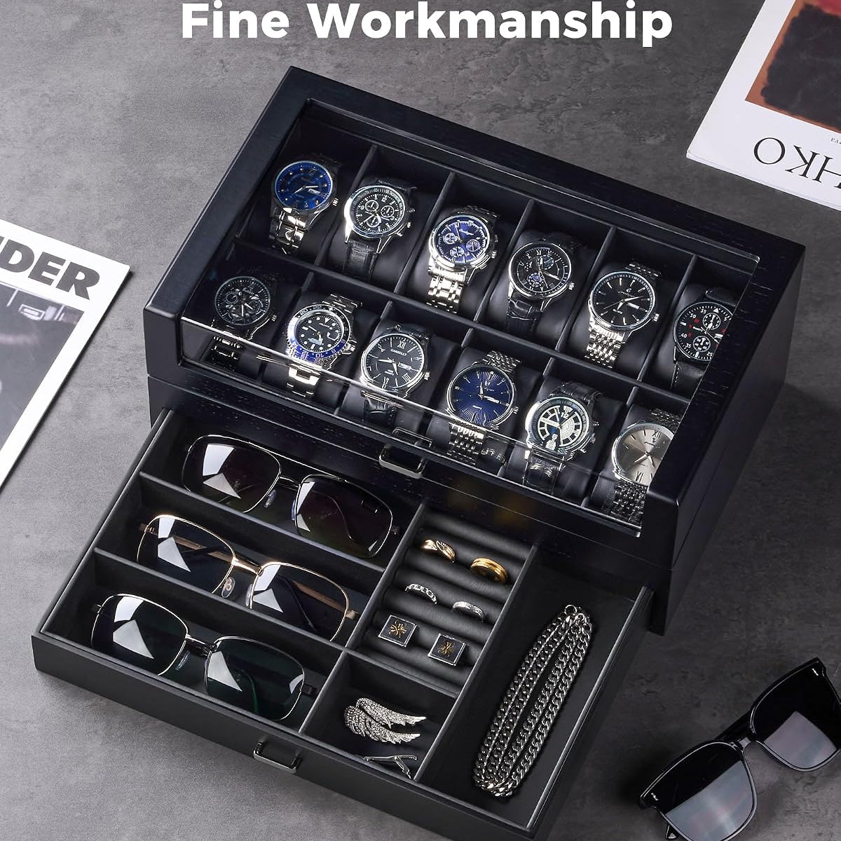 The watch compartment holds multiple wristwatches, and the drawer contains sunglasses, cufflinks, a chain necklace, and other small accessories.