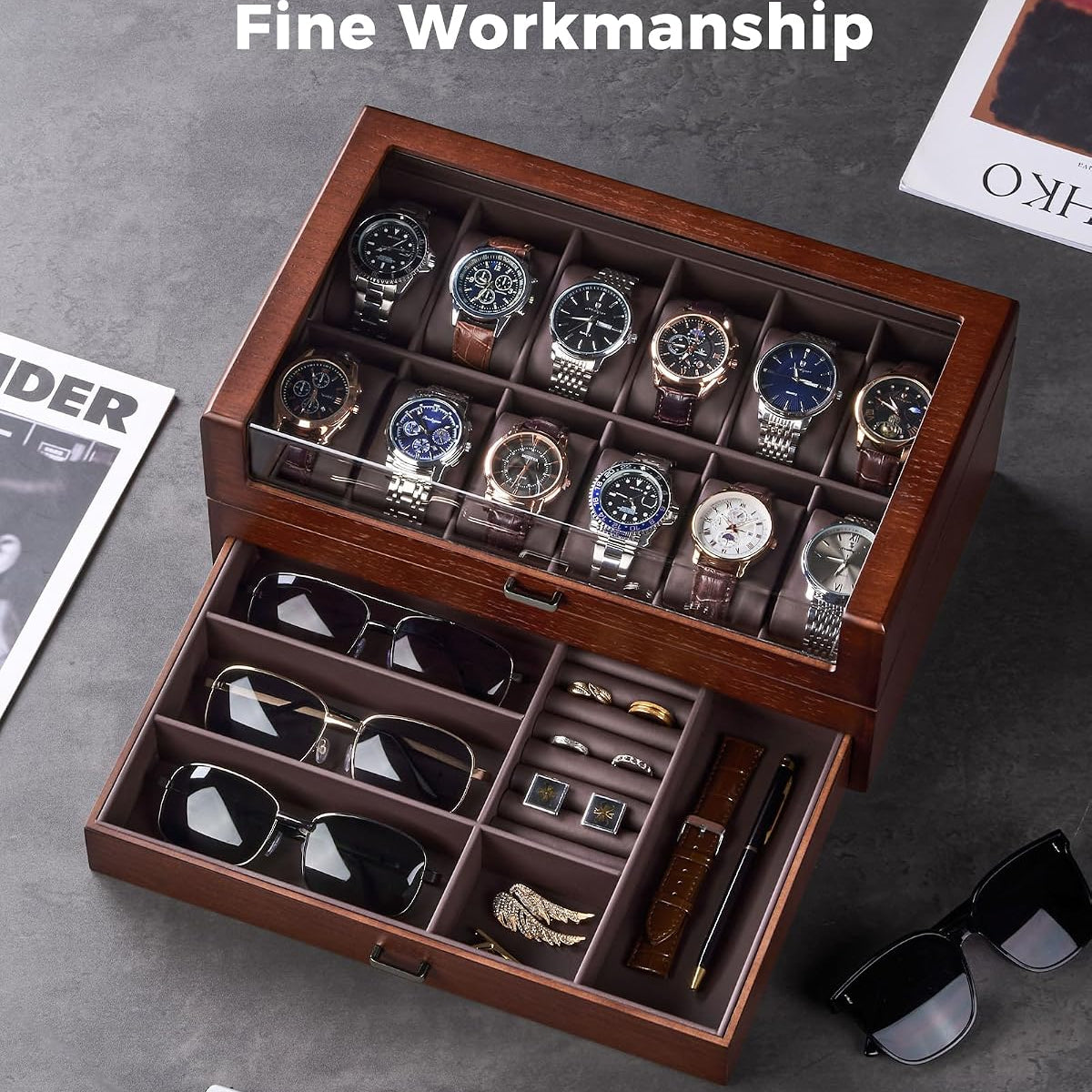 Wooden jewelry box with watches and sunglasses on a gray surface