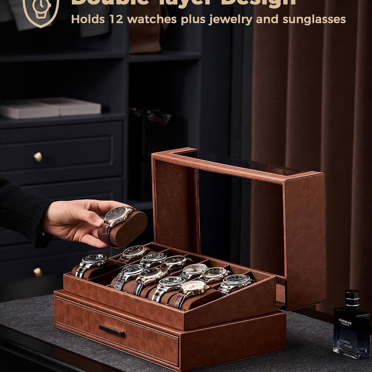 Brown double-layered jewelry and watch organizer with watches, jewelry, and sunglasses on a dark surface.