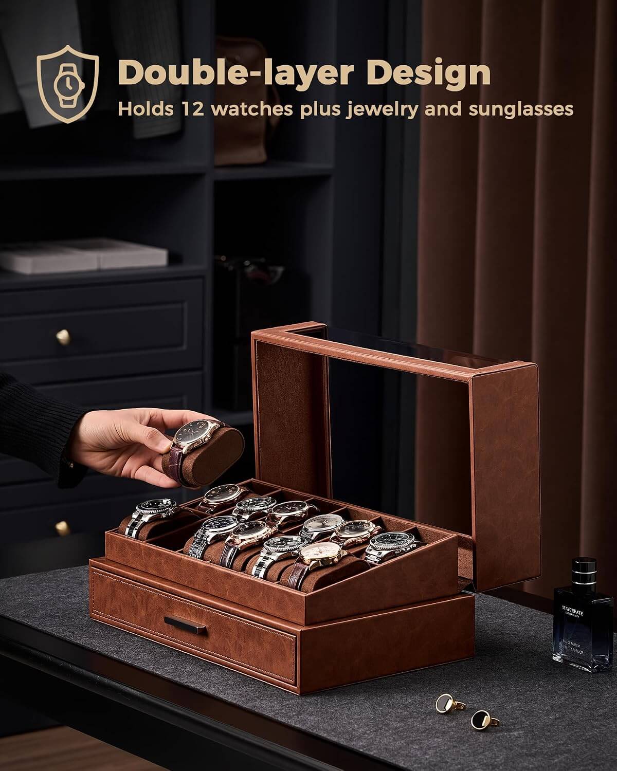 Brown double-layered jewelry and watch organizer with watches, jewelry, and sunglasses on a dark surface.