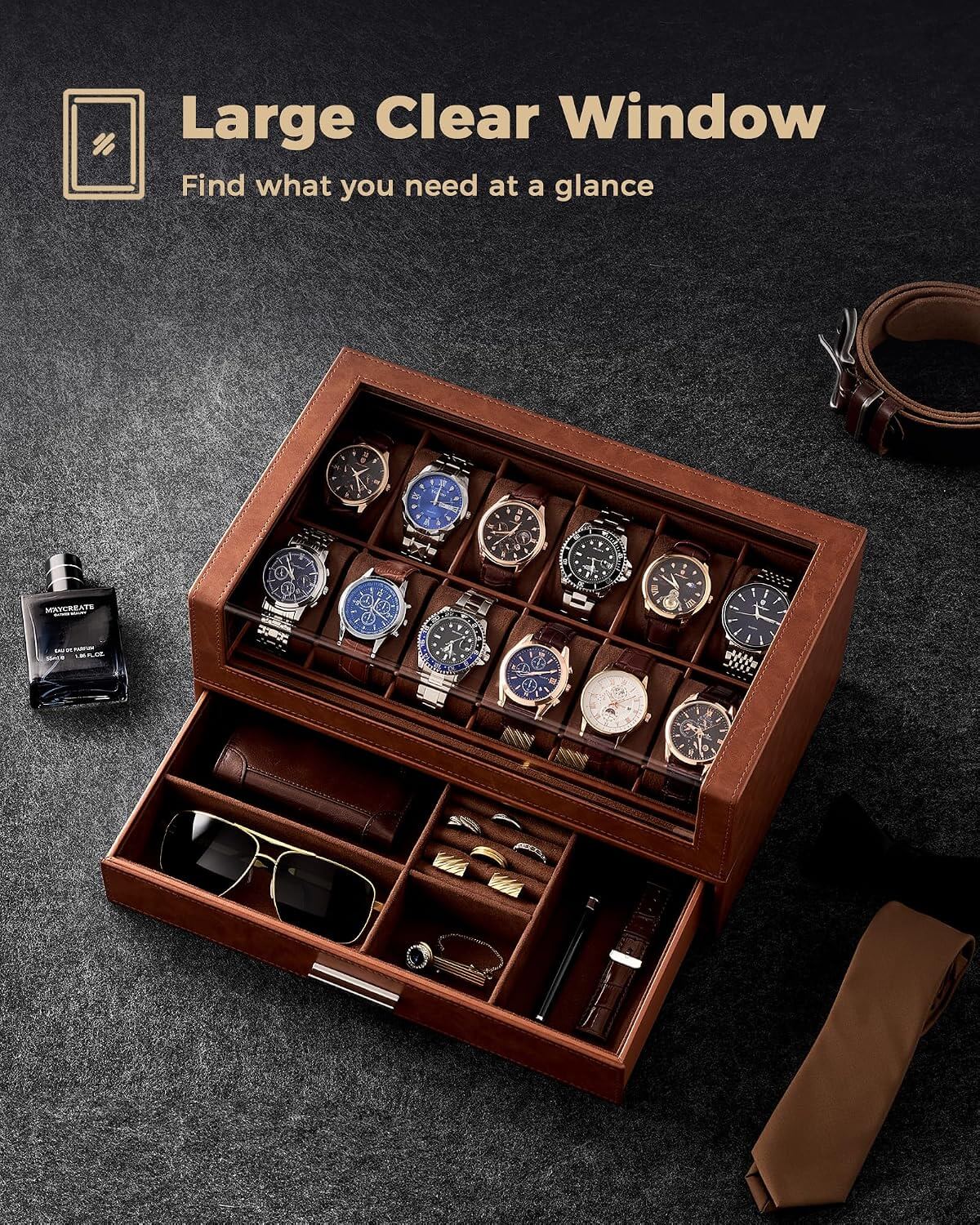 A  watch storage box with a clear top window, shown open with multiple watches inside and accessories in the drawer. The scene is styled on a dark textured surface with a bottle, belt