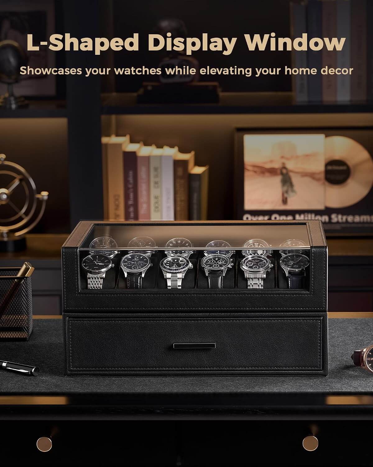 A black L-shaped watch display box with a glass top window, shown on a dark desk with several watches displayed inside. 