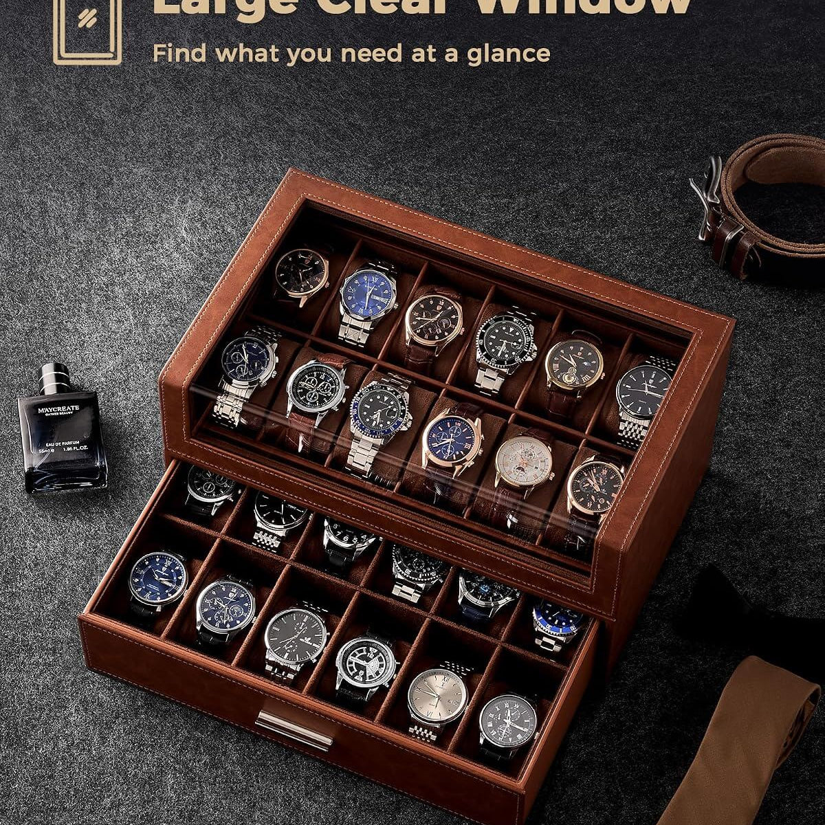 A brown wooden watch storage box with a clear glass top window, shown open with multiple wristwatches arranged inside. 