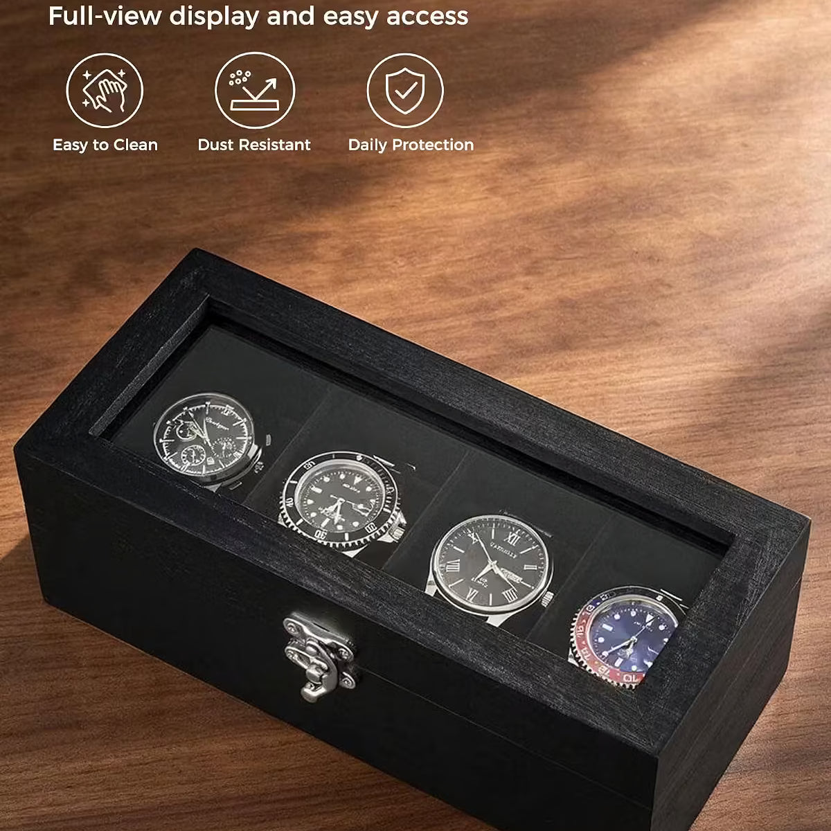 Black wooden watch box with a clear glass lid displaying four watches, set on a wooden surface with feature callouts and icons.