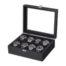 A black wooden watch display box with a glass lid, shown open and containing eight silver and black wristwatches arranged in individual slots against a plain white background.
