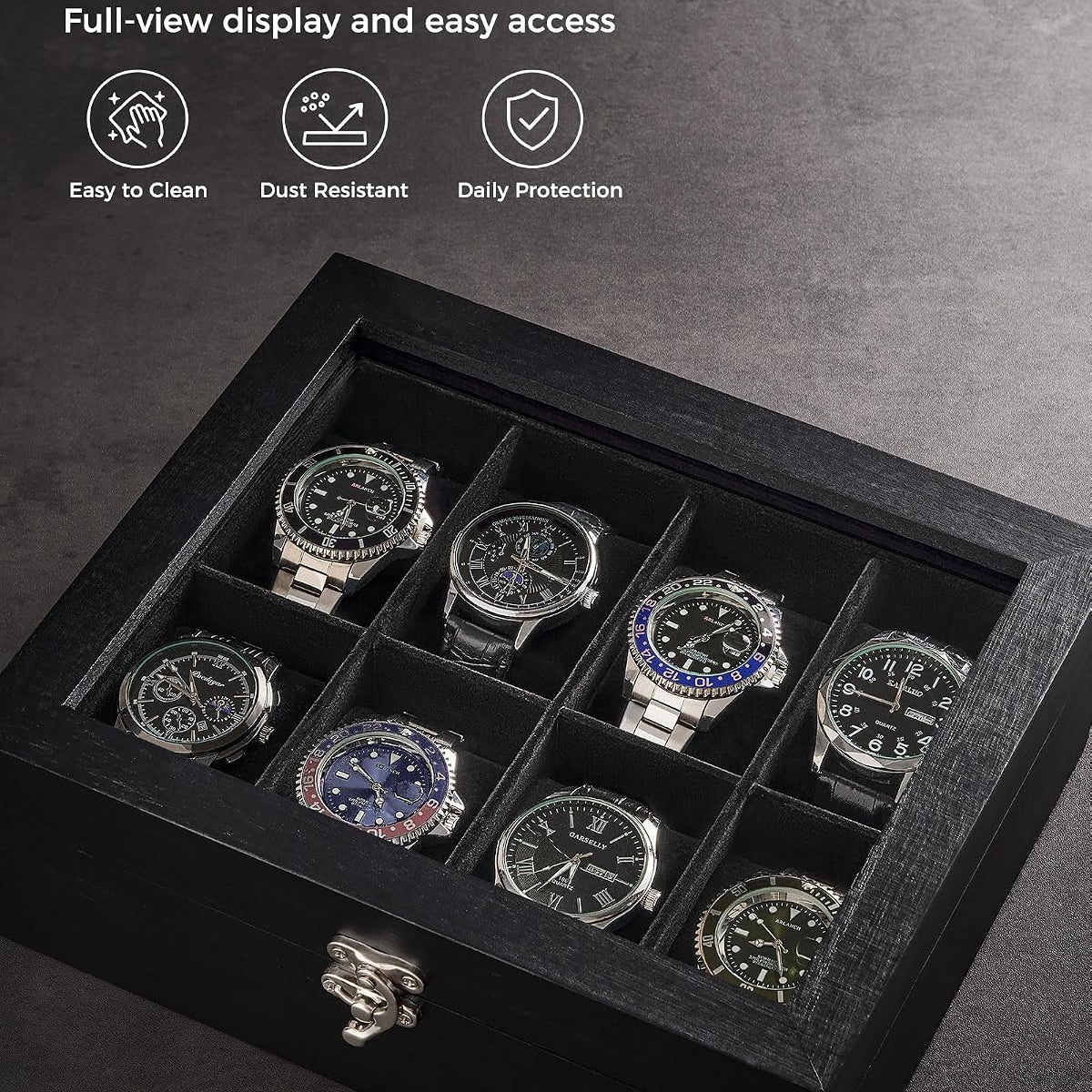 A black watch display box with a clear glass lid, shown open to reveal eight watch slots containing wristwatches. The image includes marketing text at the top highlighting the clear glass lid and features like easy cleaning, dust resistance, and daily protection.