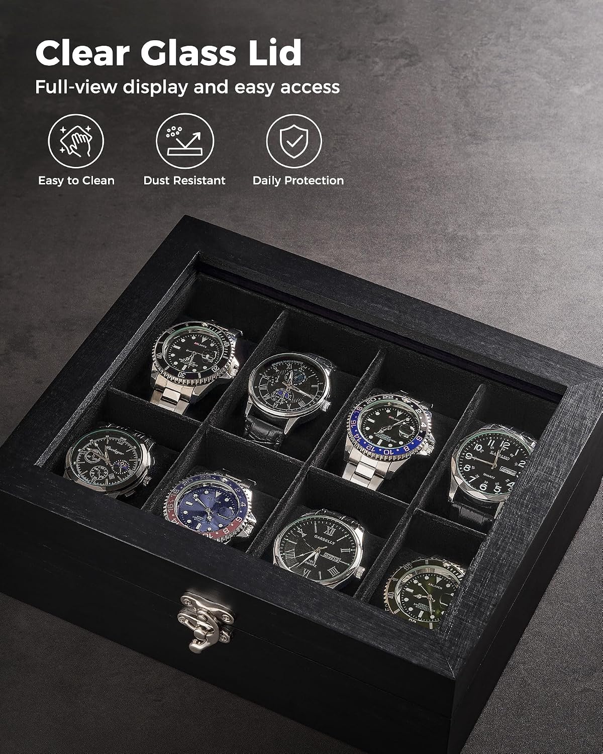 A black watch display box with a clear glass lid, shown open to reveal eight watch slots containing wristwatches. The image includes marketing text at the top highlighting the clear glass lid and features like easy cleaning, dust resistance, and daily protection.