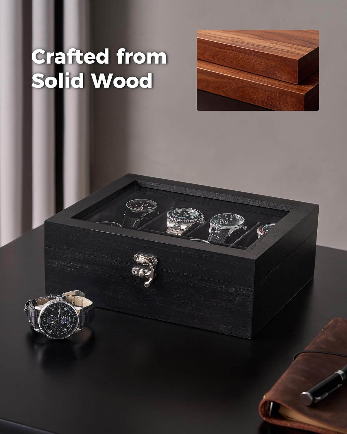 A black wooden watch box with a clear top window displaying several watches inside, placed on a dark tabletop. A matching inset image in the top right shows the wood grain detail, and the text 'Crafted from Solid Wood' appears on the left.