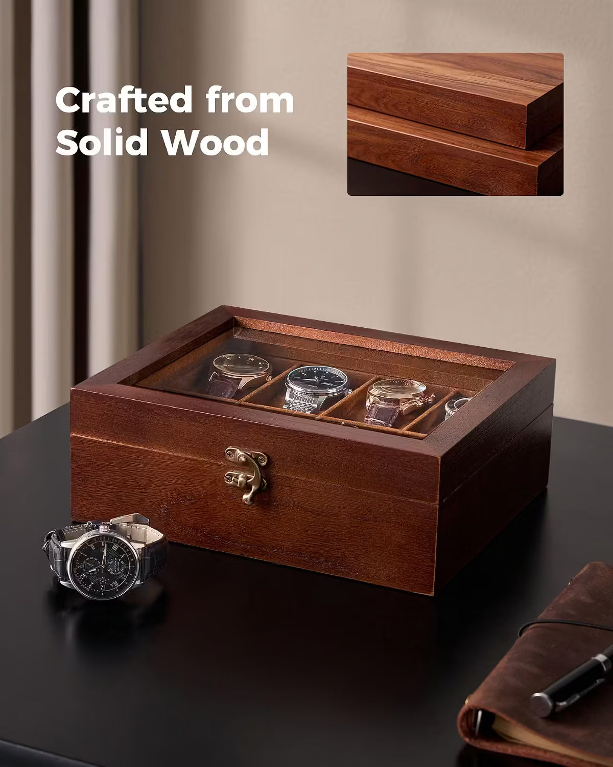 A wooden watch display box with a glass top, shown on a dark tabletop with a few watches inside. The image includes the text 'Crafted from Solid Wood' and a small inset showing a close-up of the wood grain on the lid.