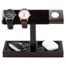 Wooden jewelry stand with two watches, a car key, and a white object on