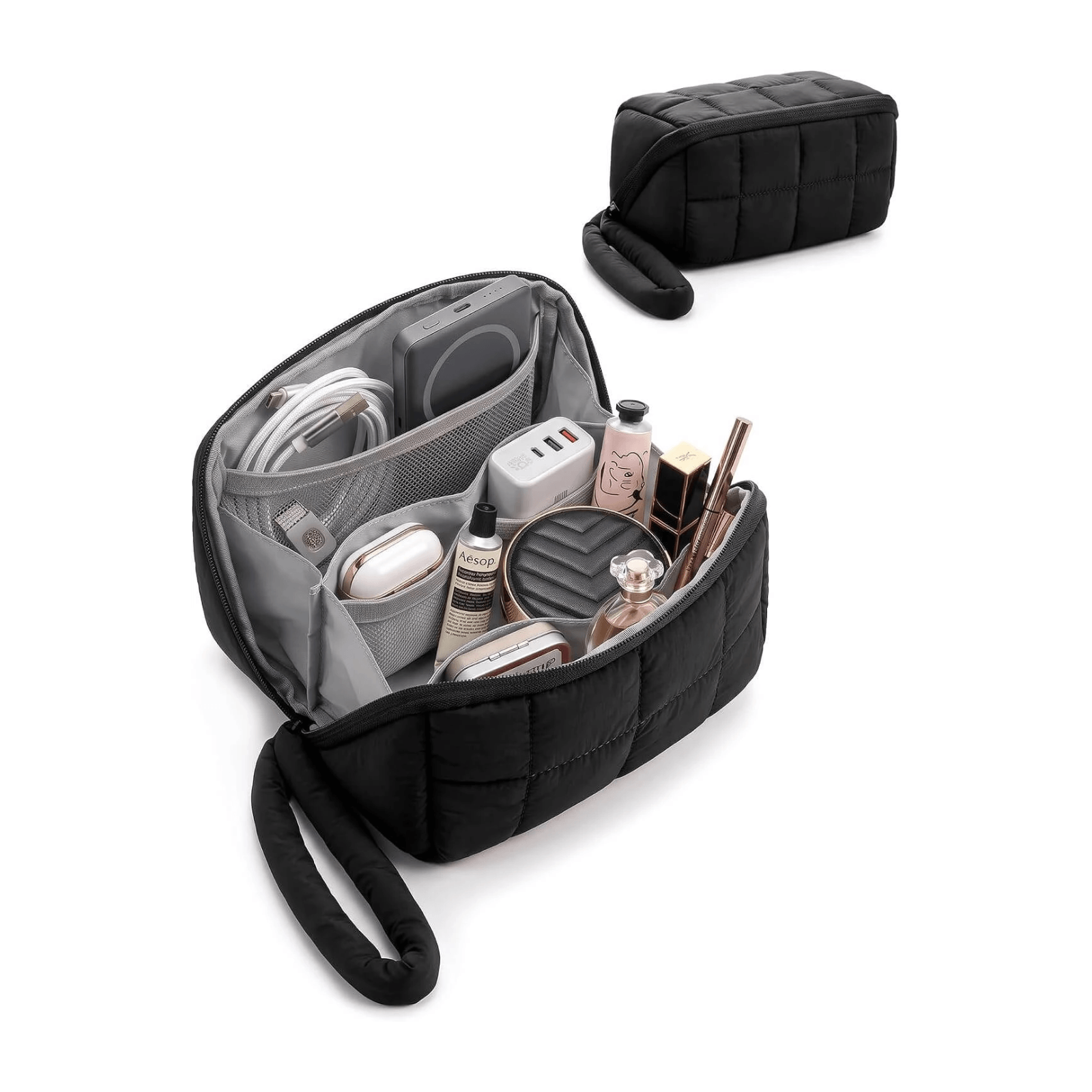 A black quilted travel puffy tech pouch shown open, filled with cosmetics, earbuds, and accessories, with a smaller closed view of the same pouch above on a white background.