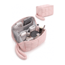 A light pink puffy tech pouch shown open with various makeup items and accessories inside, plus a smaller closed view of the same bag in the upper right on a clean white background.